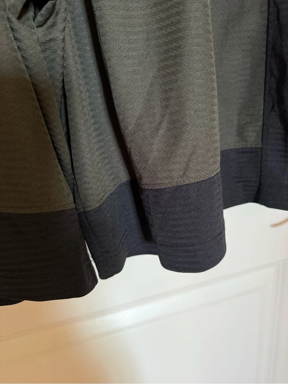 Nike Men's Olive Green Athletic Shorts with Black Panels and Red Swoosh